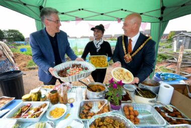 People sharing food at a Wolverhampton allotment Great Get Together.