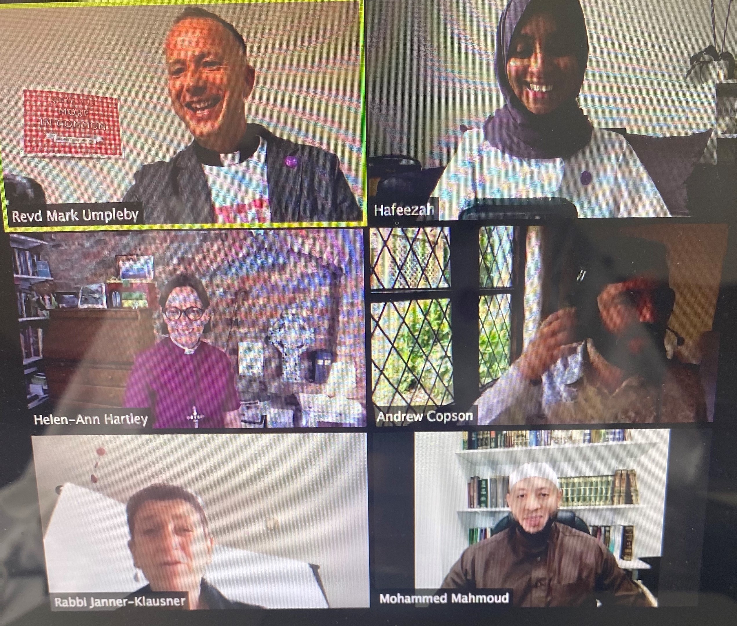 6 people are on a video call, three men and three women all of different ages and faiths